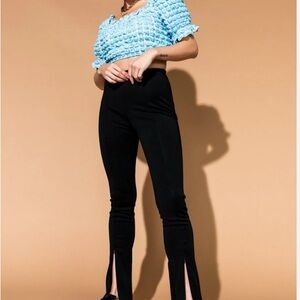 Dressed in LALA Black Skinny Pants with front zippers